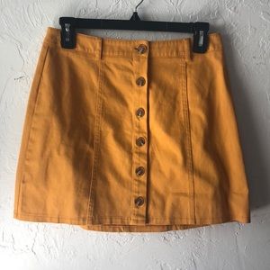 Yellow button mini skirt